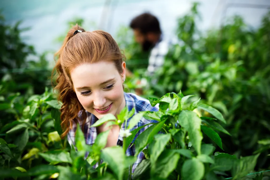 Attractive happy female farmer working in greenhou 2025 03 14 18 18 19 utc