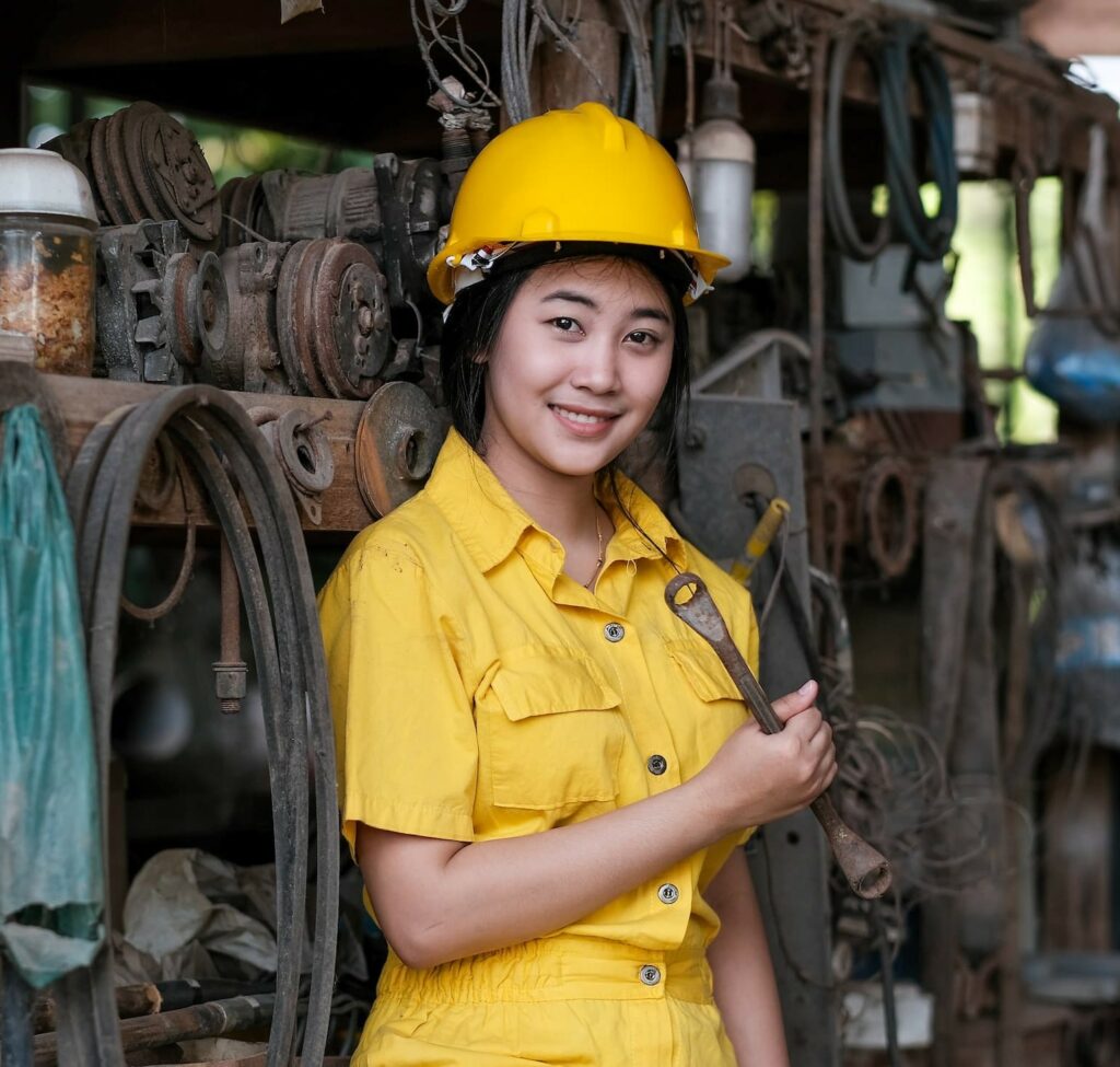 Asian pretty technician girl hold old wrench and s 2025 03 08 15 31 57 utc young worker