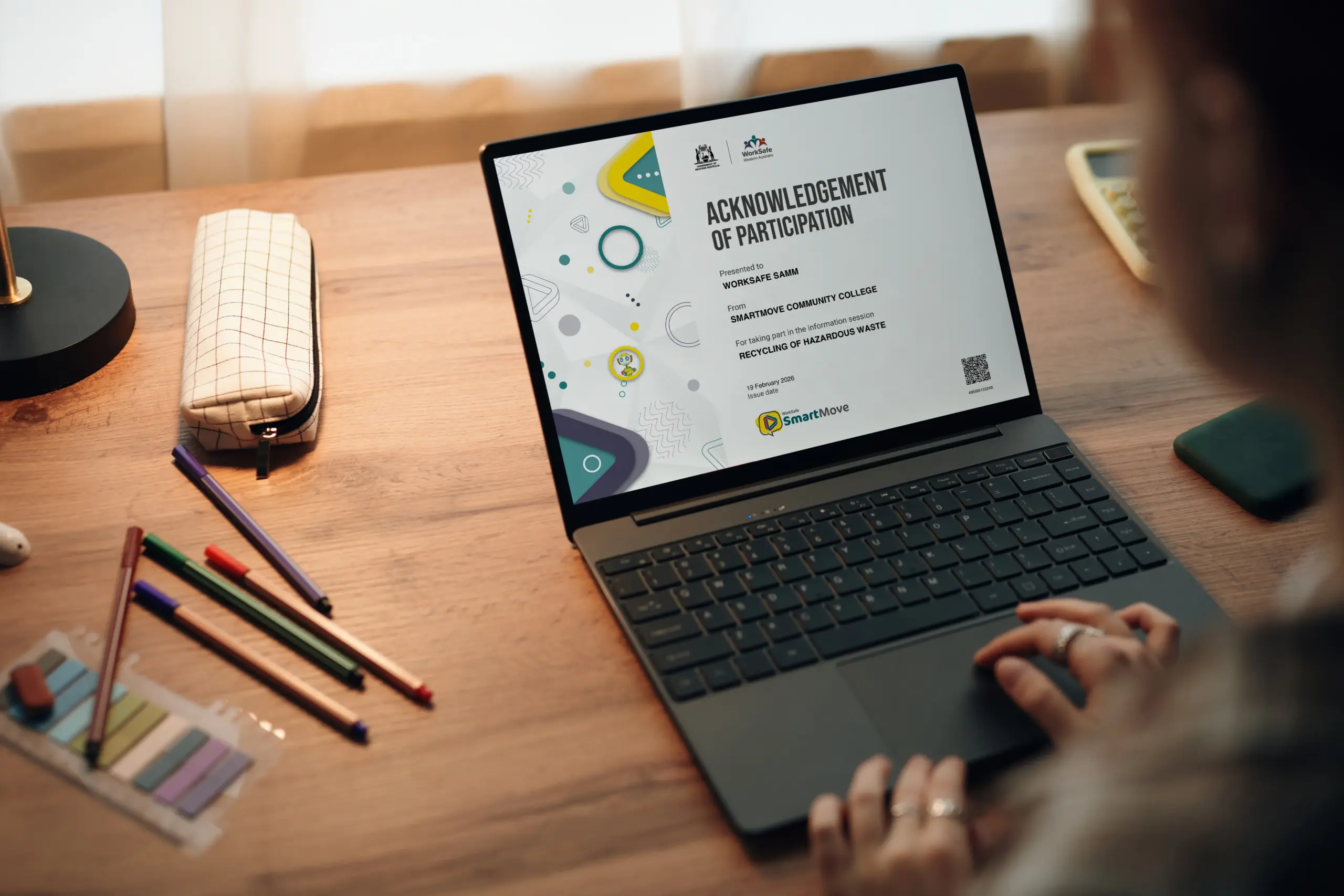 Young people with a certificate of completion on computer